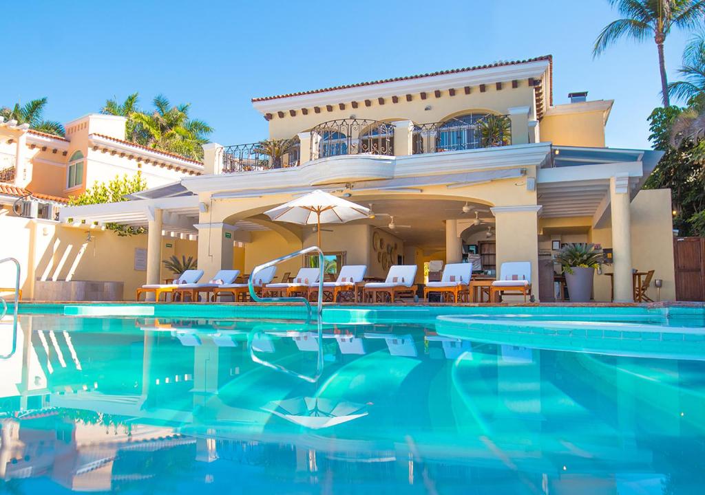 Casa Velas Puerto Vallarta adults-only boutique all-inclusive resort with lush gardens, intimate pools, and refined Mexican hacienda-style architecture.