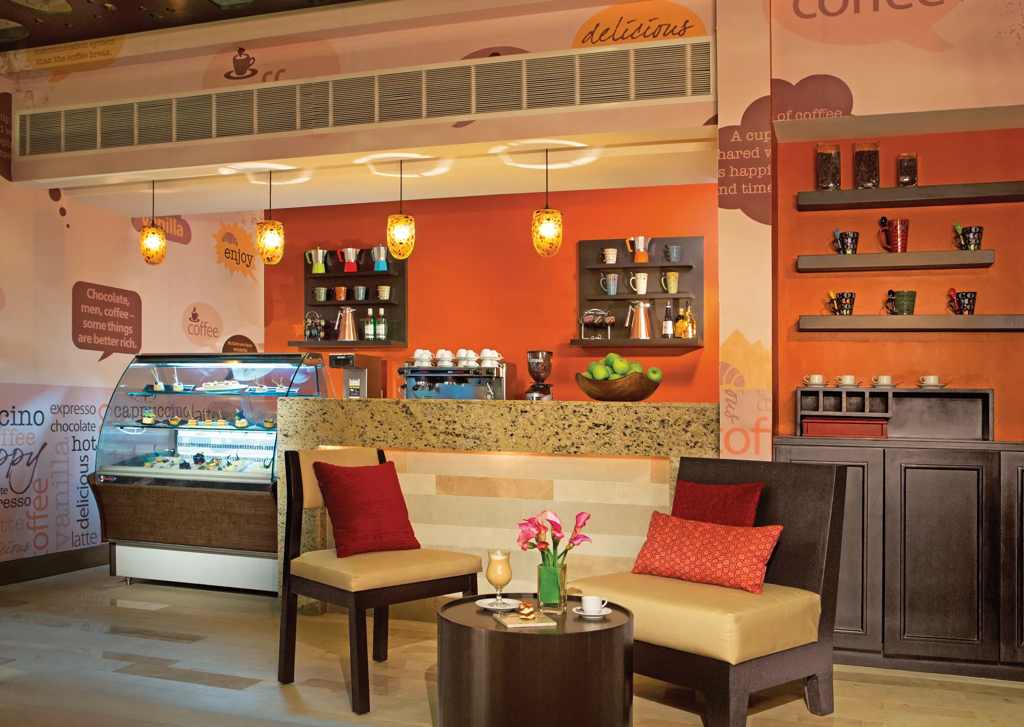 Coco Café at Secrets Vallarta Bay Puerto Vallarta featuring a cozy coffee shop atmosphere with pastries, sandwiches, and specialty drinks available 24 hours.
