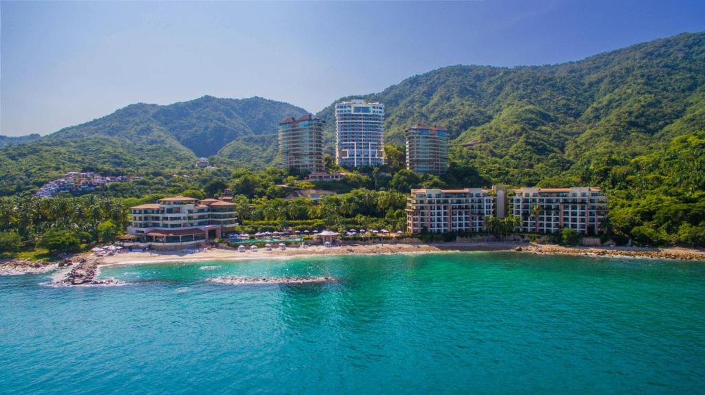 Garza Blanca Preserve Resort and Spa Puerto Vallarta luxury beachfront resort with infinity pools, modern suites, and jungle setting.