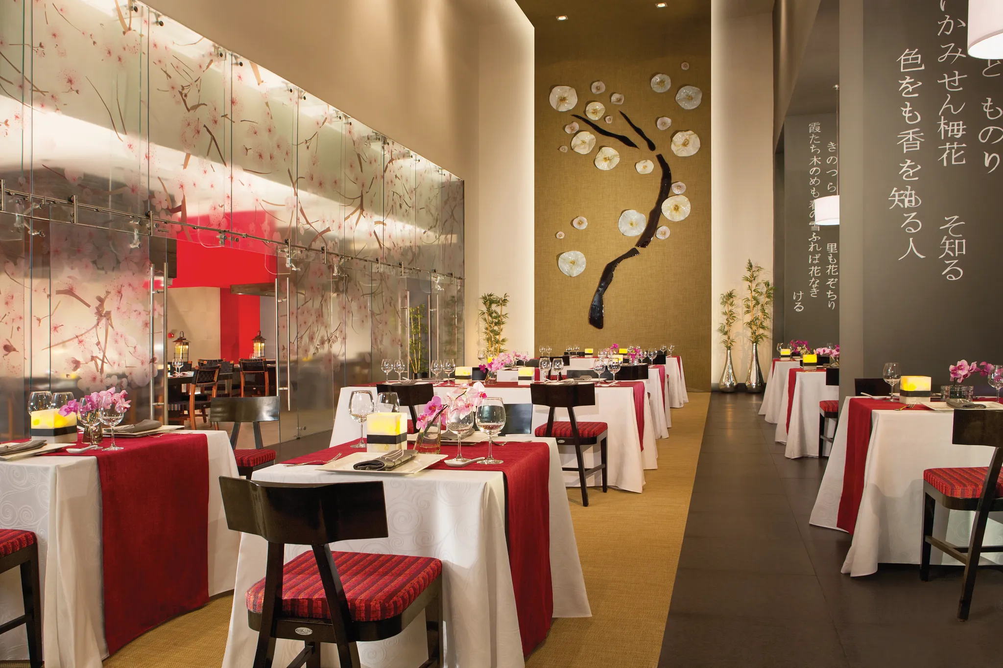 Himitsu Pan-Asian restaurant at Secrets Vallarta Bay Puerto Vallarta featuring teppanyaki tables, sushi bar, and elegant Asian-inspired dining atmosphere.