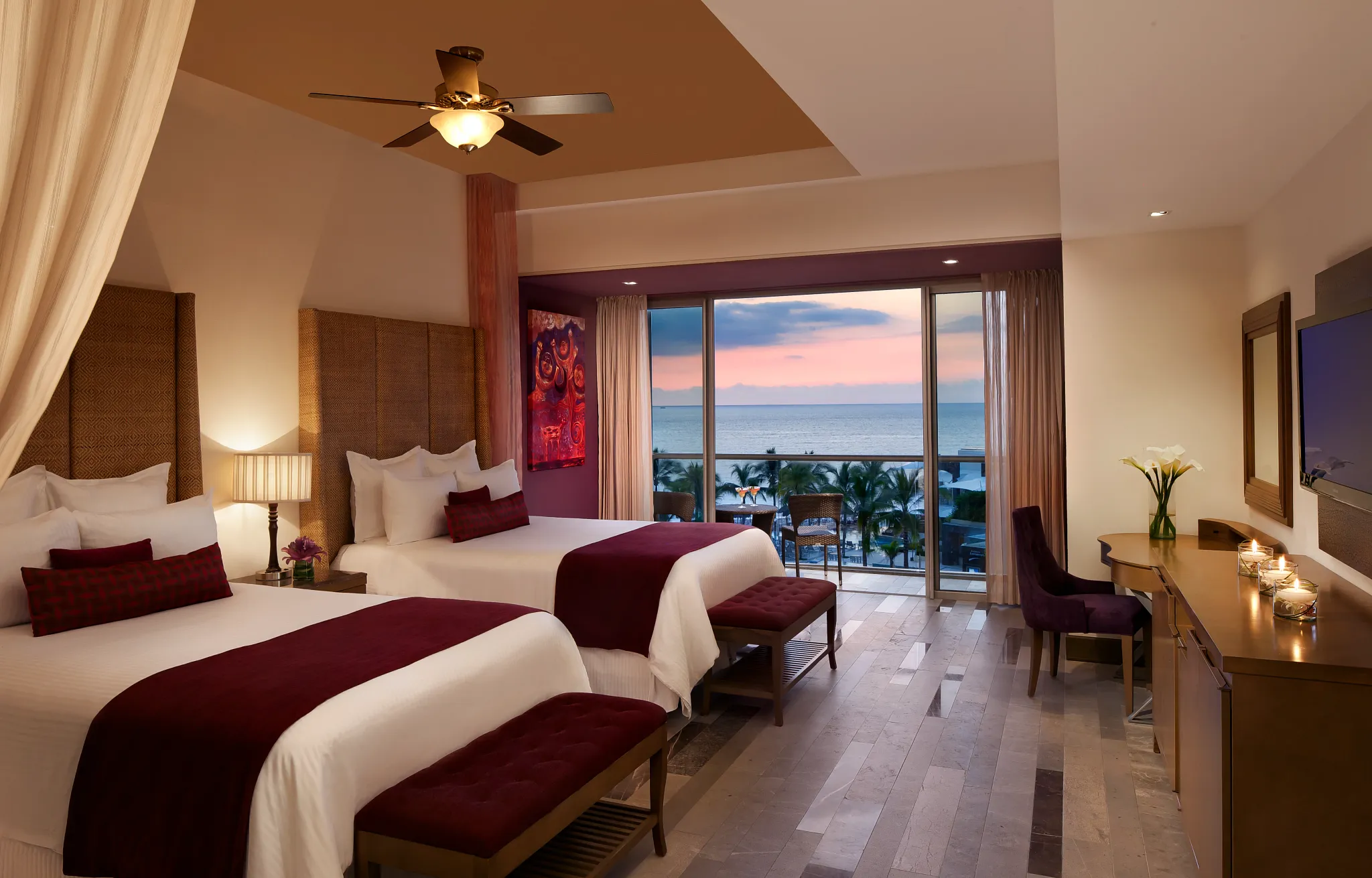 Junior Suite Ocean View with two double beds and sunset ocean views at Secrets Vallarta Bay Puerto Vallarta.