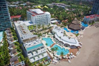 Krystal Grand Puerto Vallarta all-inclusive resort with beachfront pools, family amenities, and tropical gardens in Mexico.
