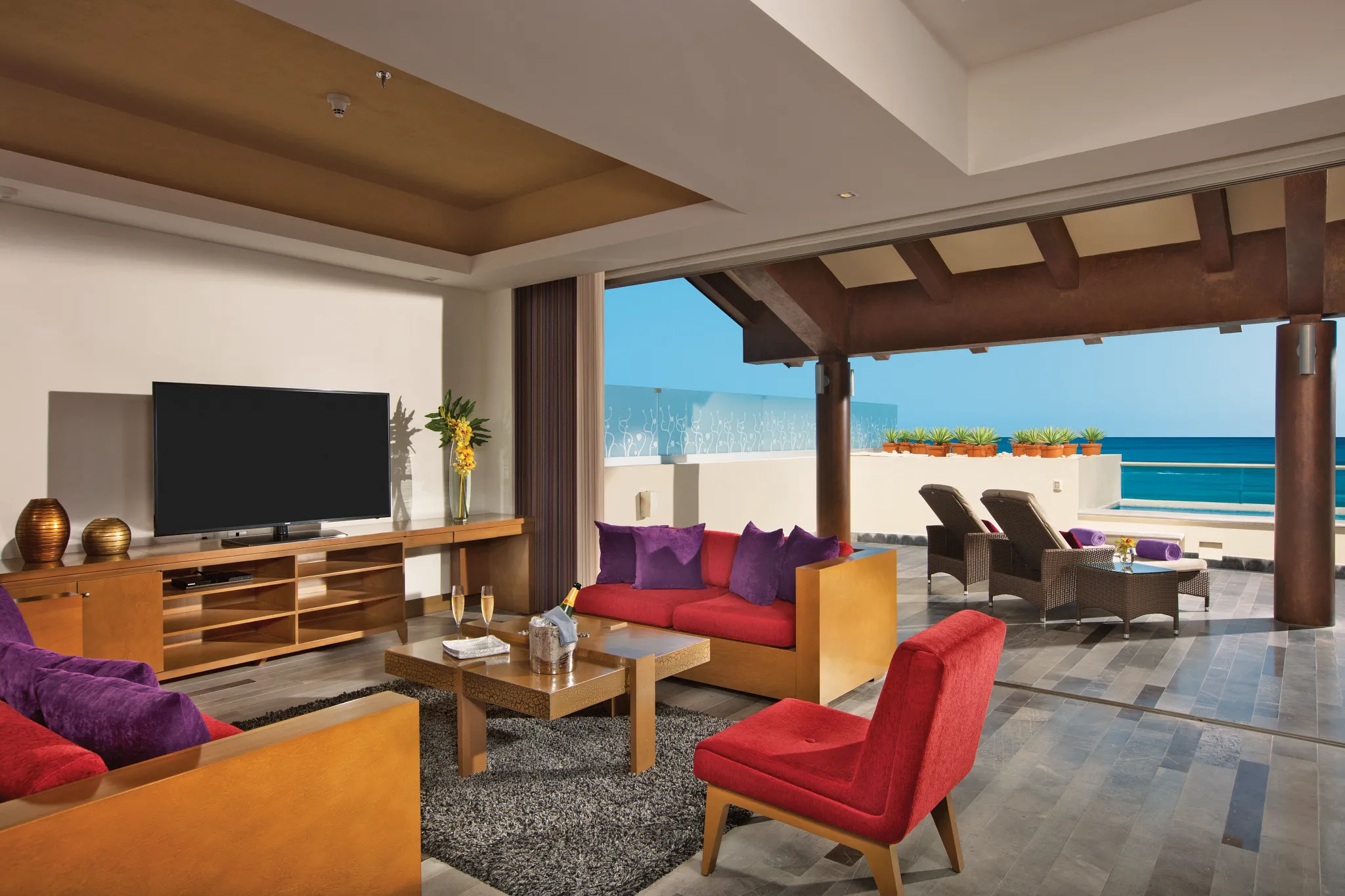 Presidential Suite living room with oceanfront terrace access at Secrets Vallarta Bay Puerto Vallarta.