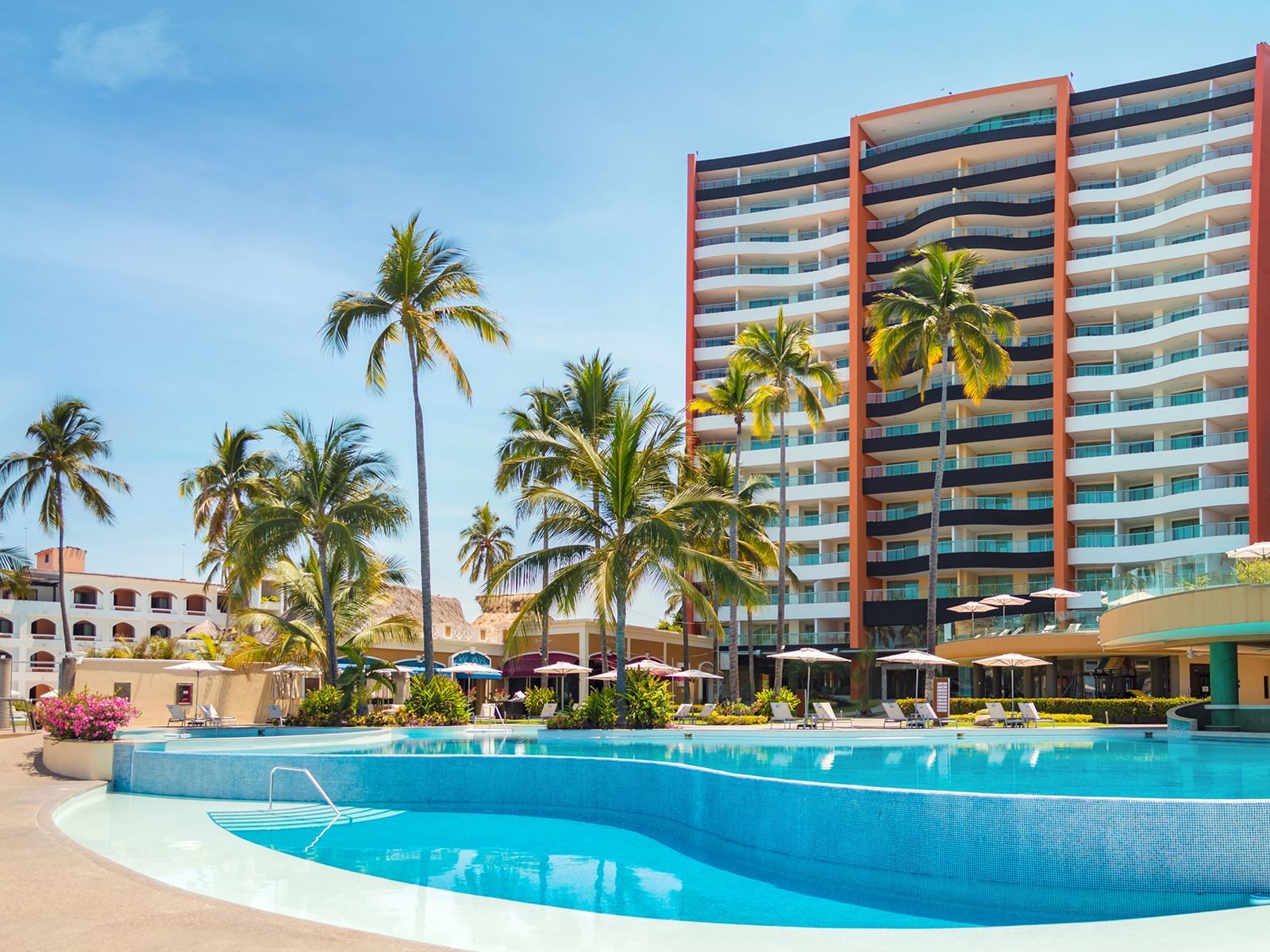 Sunset Plaza Beach Resort and Spa Puerto Vallarta beachfront hotel with ocean view pools and casual family-friendly atmosphere.